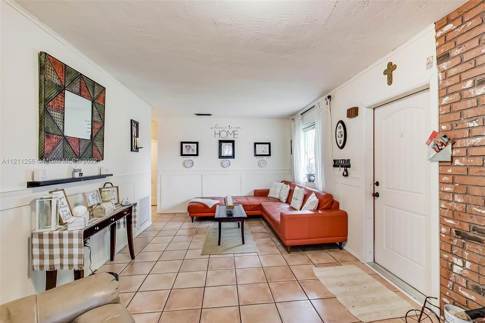 9345 Southwest 42nd Terrace Miami, FL 33165 - Photo 8 of 48 a living room with furniture and a rug