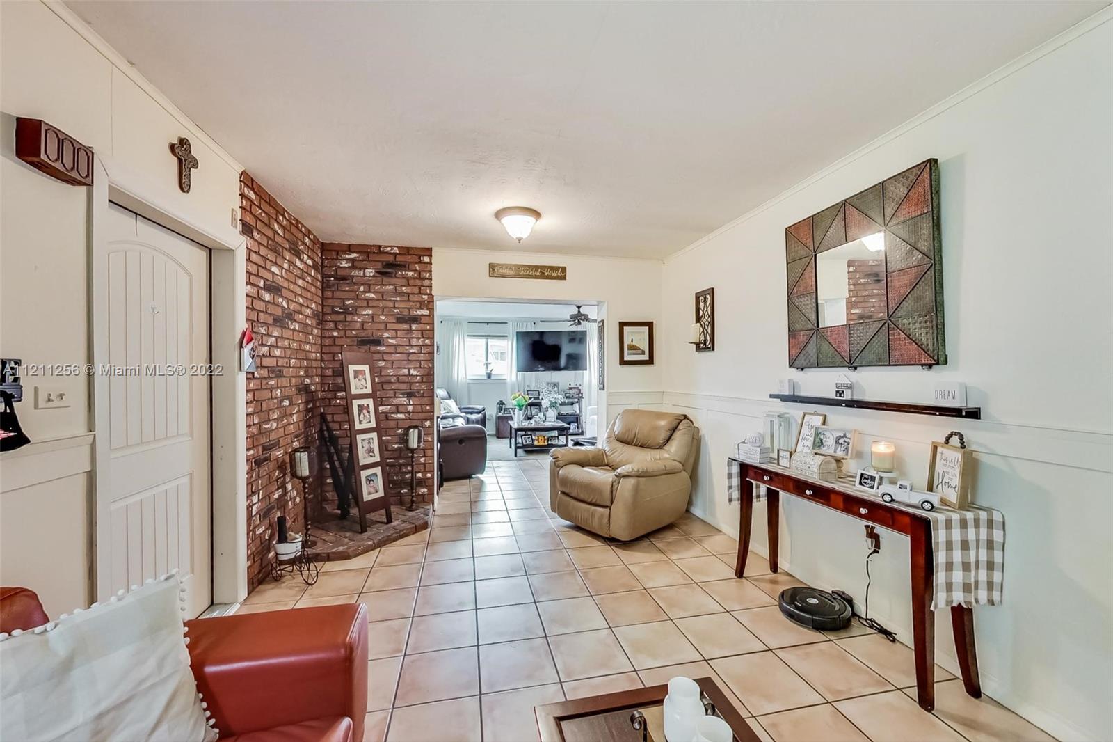 9345 Southwest 42nd Terrace Miami, FL 33165 - Photo 10 of 48 a living room with furniture and a couch