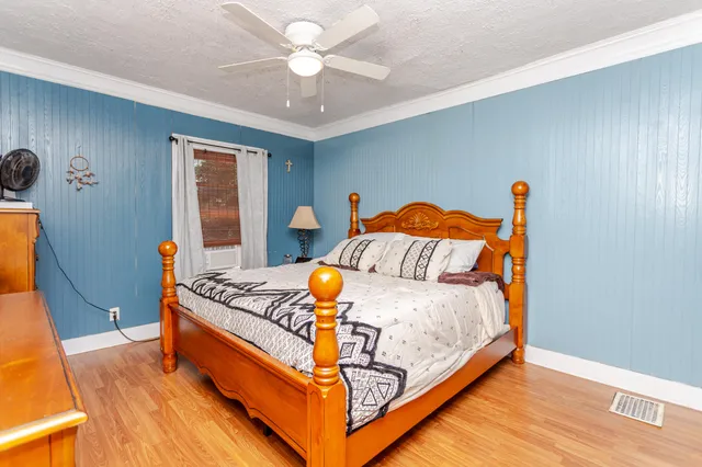 a bed room with a bed and a chandelier