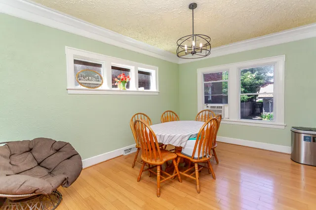 a dining room with furniture and window