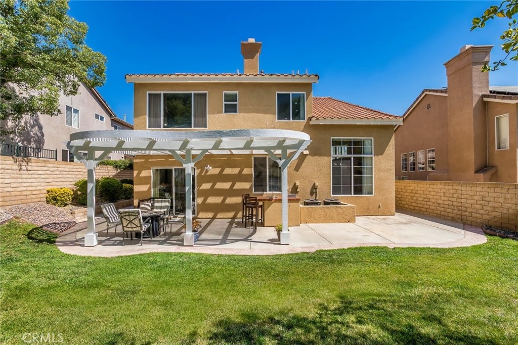 25707 Lewis Way Stevenson Ranch, CA 91381 - Photo 13 of 35 a front view of a house with dining space