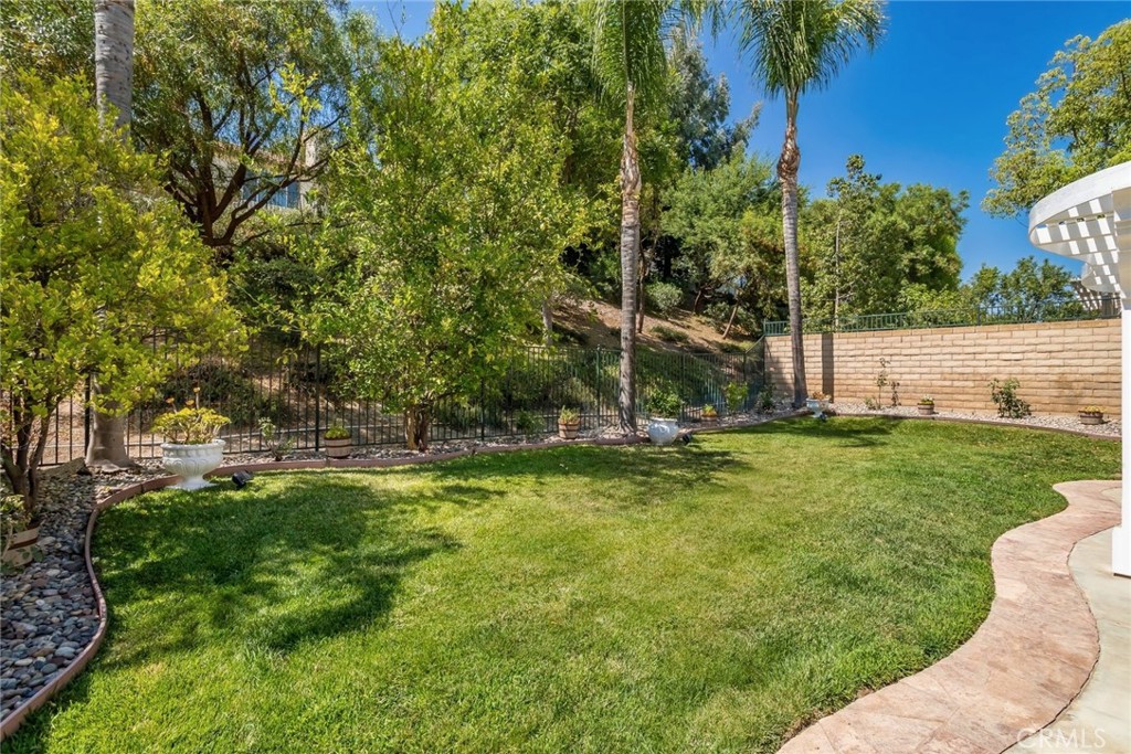 25707 Lewis Way Stevenson Ranch, CA 91381 - Photo 16 of 35 a view of a backyard with large trees