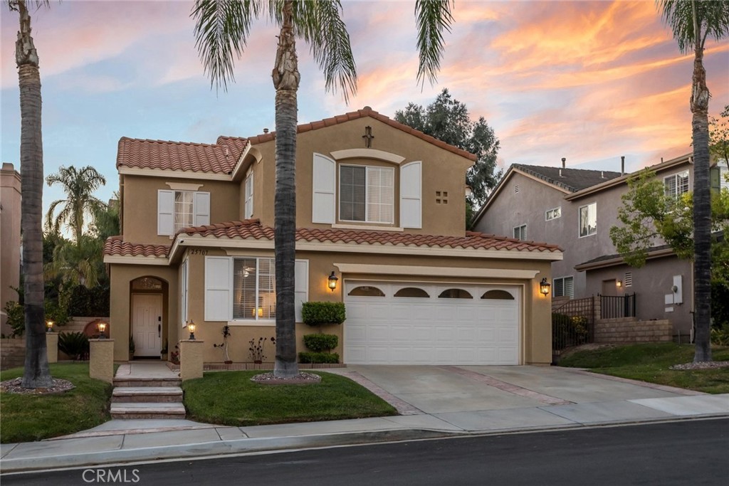 25707 Lewis Way Stevenson Ranch, CA 91381 - Photo 20 of 35 a view of a white house with a yard and palm trees
