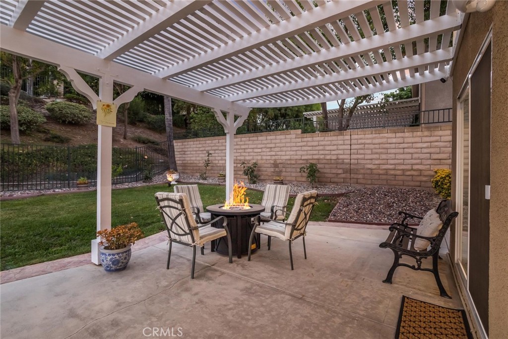25707 Lewis Way Stevenson Ranch, CA 91381 - Photo 23 of 35 a roof deck with table and chairs and potted plants