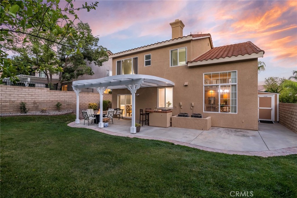 25707 Lewis Way Stevenson Ranch, CA 91381 - Photo 25 of 35 a view of a house with a yard and sitting area