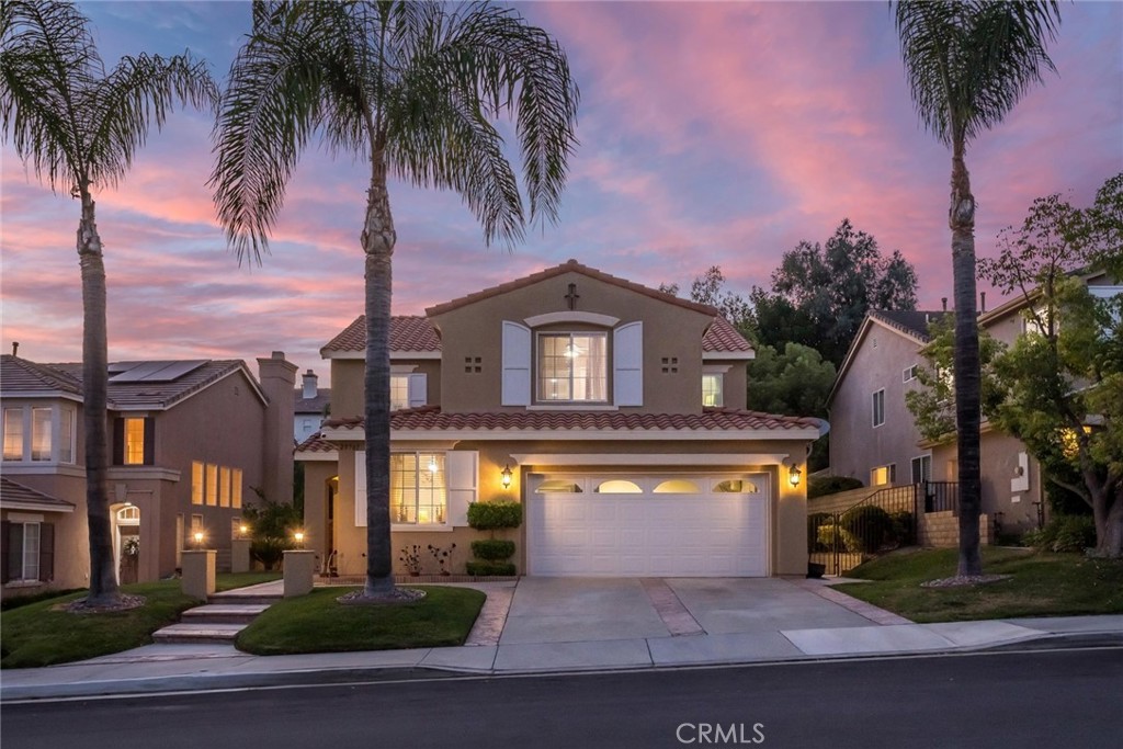 25707 Lewis Way Stevenson Ranch, CA 91381 - Photo 27 of 35 a front view of a house with a garden