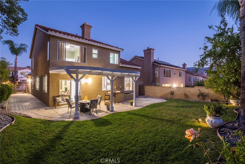 25707 Lewis Way Stevenson Ranch, CA 91381 - Photo 30 of 35 a front view of a house with garden and sitting area