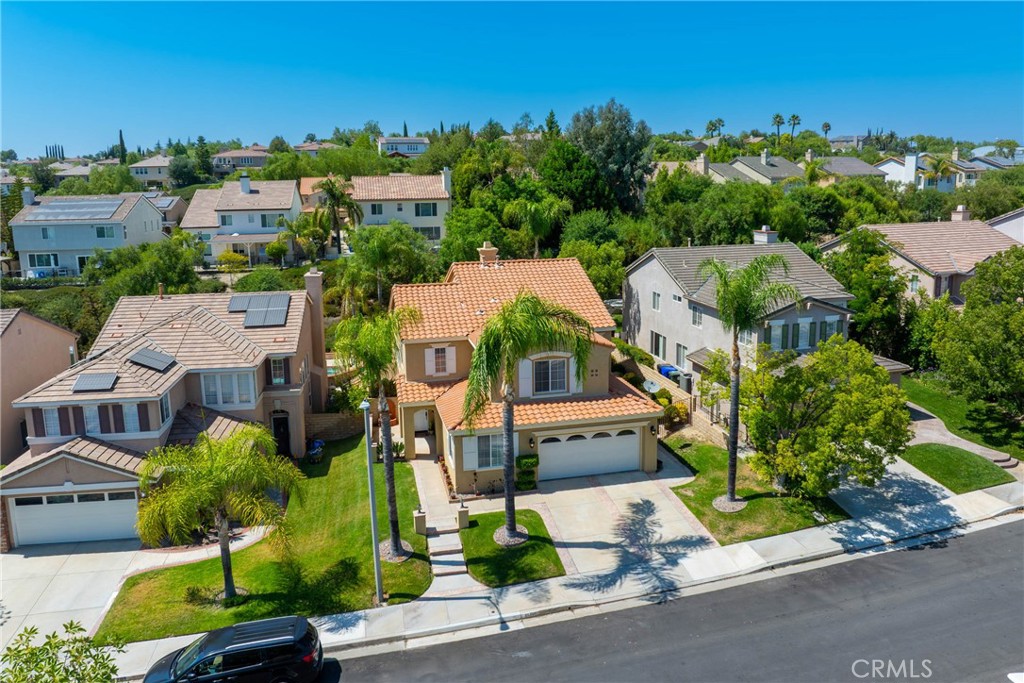 25707 Lewis Way Stevenson Ranch, CA 91381 - Photo 33 of 35 an aerial view of multiple houses with yard