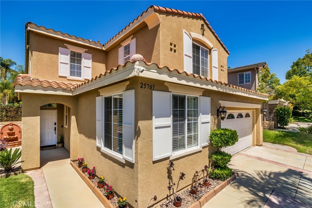 25707 Lewis Way Stevenson Ranch, CA 91381 - Photo 7 of 35 a front view of a house with garden