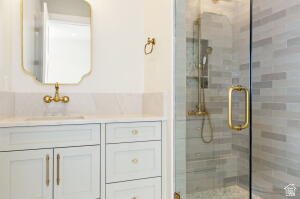 1141 East Lost Ridge Drive Washington, UT 84780 - Photo 103 of 108 Bathroom vanity with white cabinetry and gold-tone hardware