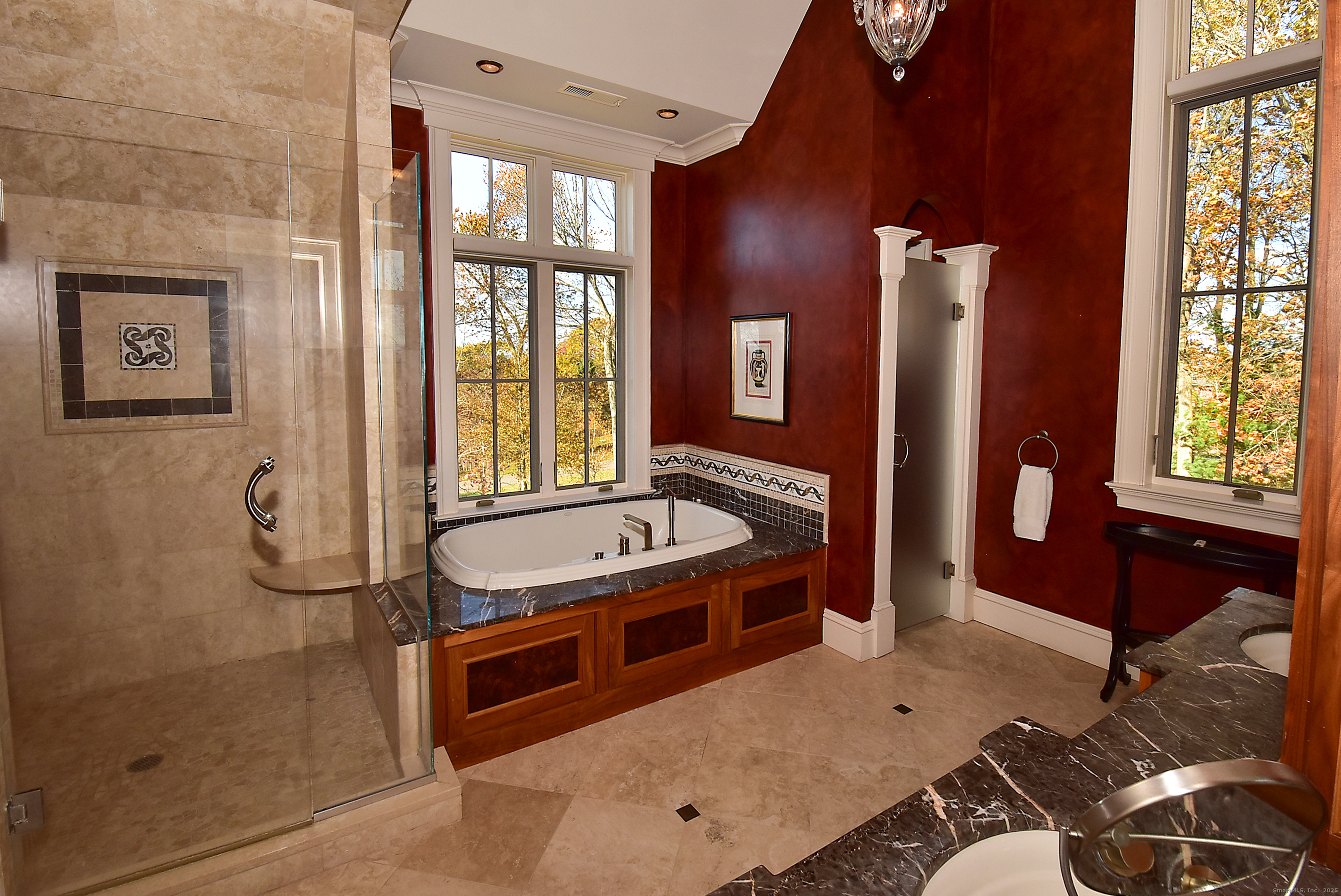 6 Setting Sun Trail Ellington, CT 06029 - Photo 26 of 40 a bathroom with a tub a sink and glass windows