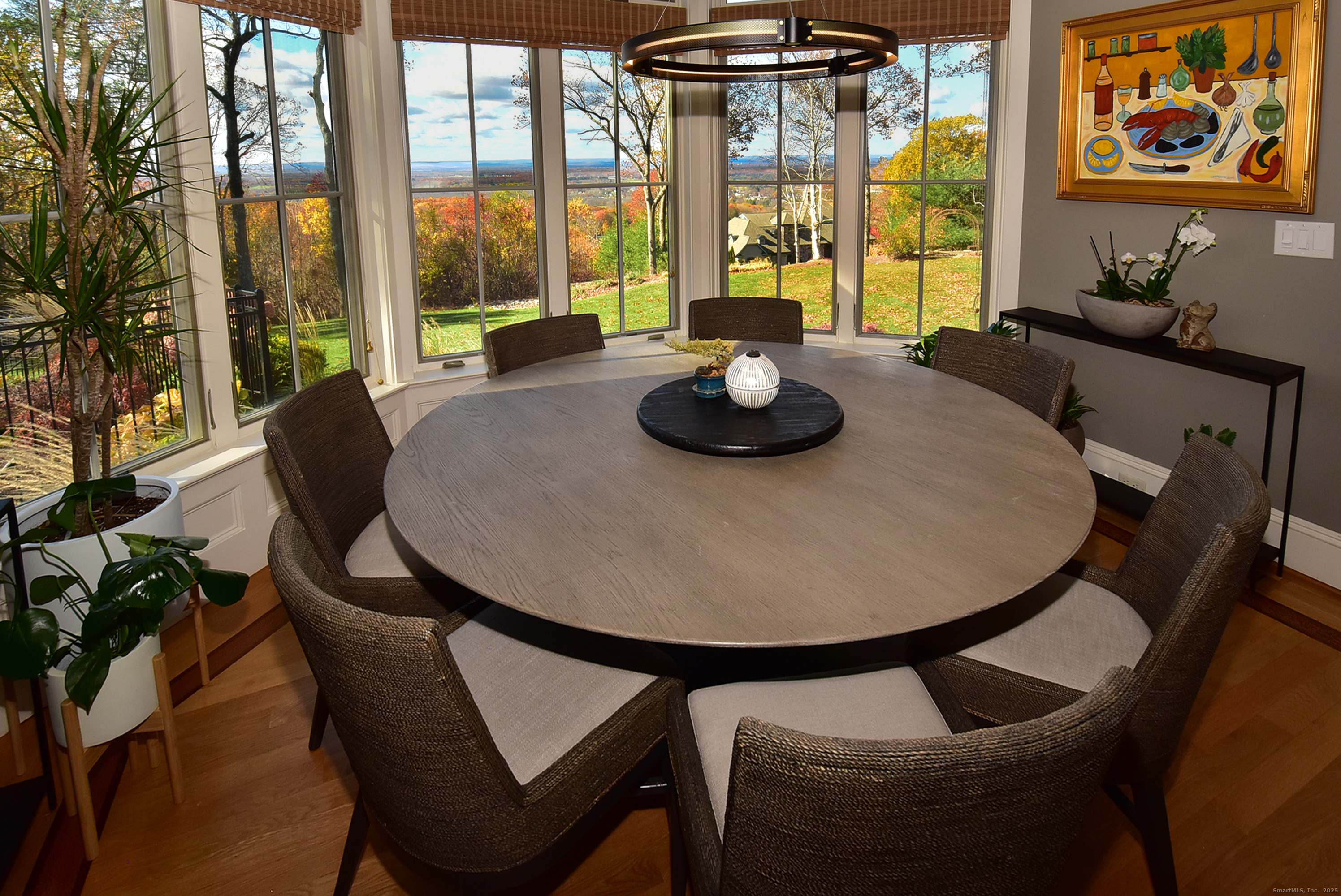 6 Setting Sun Trail Ellington, CT 06029 - Photo 10 of 40 a view of a dining room with furniture large windows and wooden floor