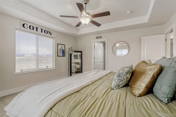 a bed room with a bed and a window