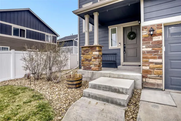 a front view of a house with fountain