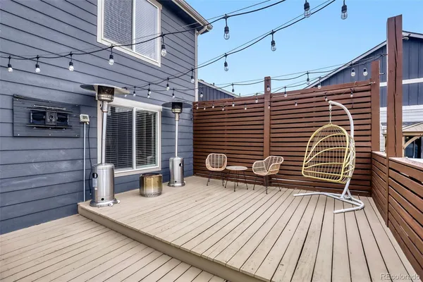 a view of a patio with a table and chairs