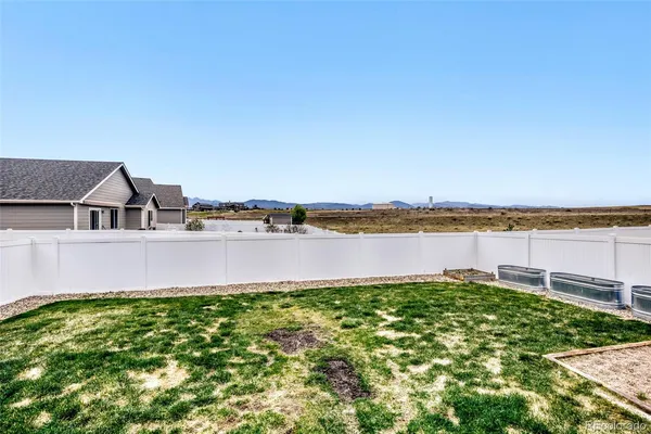 a view of a lake with houses in the background