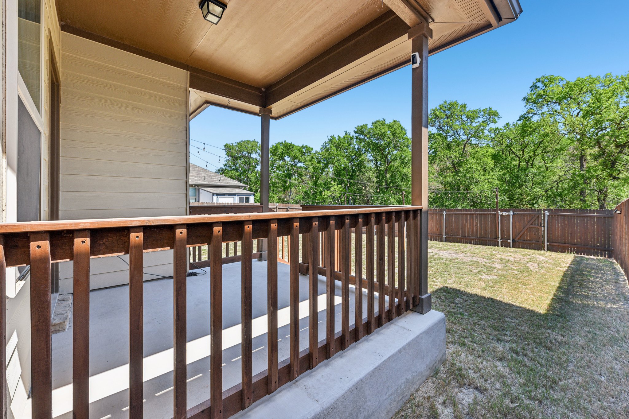 908 Goldilocks Lane Manchaca, TX 78652 - Photo 24 of 34 A charming covered back porch sits off the back of the home and overlooks the huge backyard.