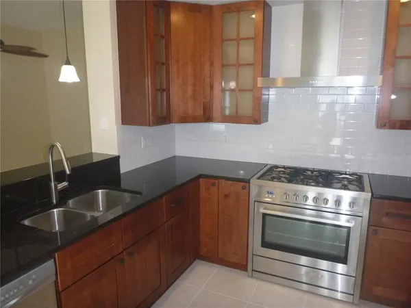 a kitchen with a sink and a microwave