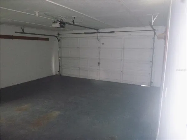 a view of a storage & utility room with cabinets