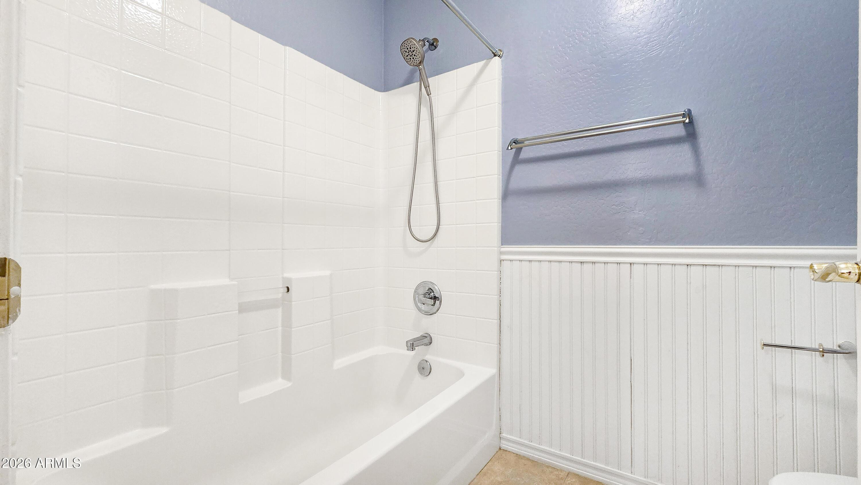 14226 West Wethersfield Road Surprise, AZ 85379 - Photo 41 of 50 a bathroom with a bathtub and a shower