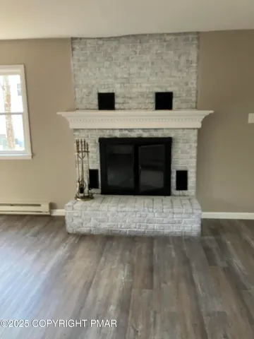 a living room with a fireplace and a table