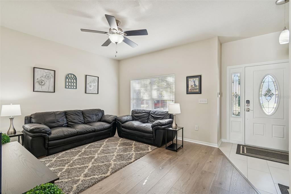 5956 Desert Peace Avenue Land O' Lakes, FL 34639 - Photo 11 of 79 a living room with furniture and a window