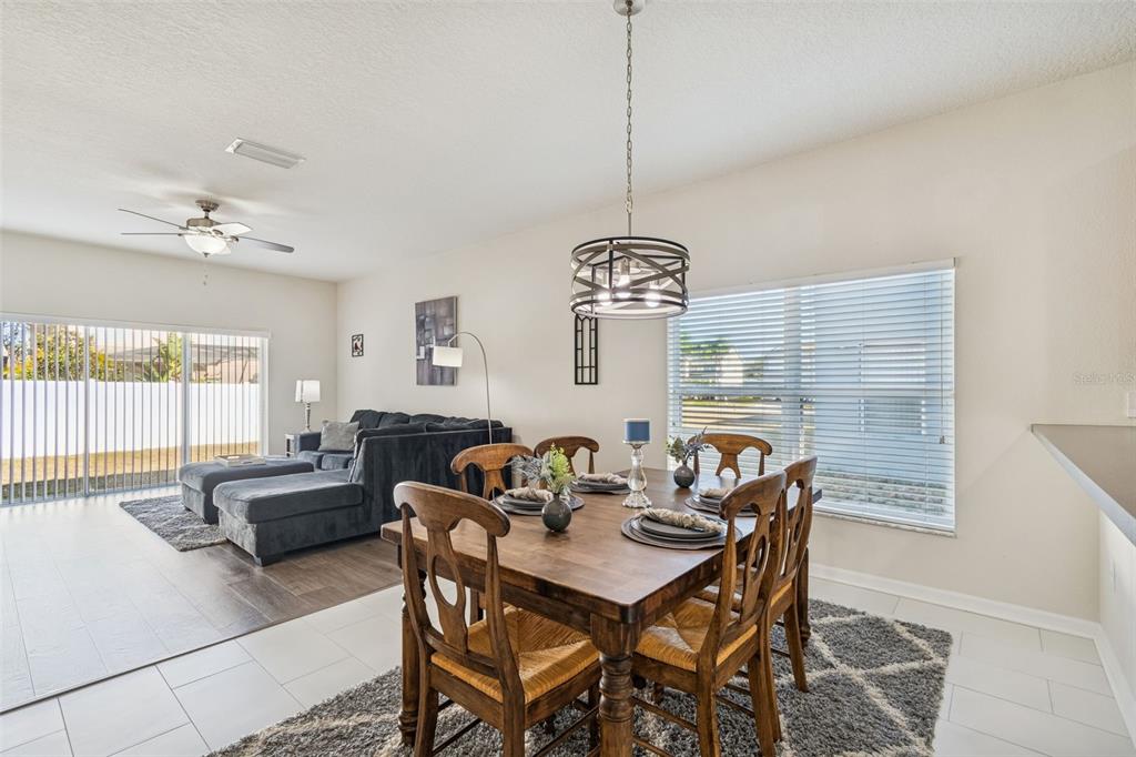 5956 Desert Peace Avenue Land O' Lakes, FL 34639 - Photo 23 of 79 a view of a dining room with furniture window and outside view