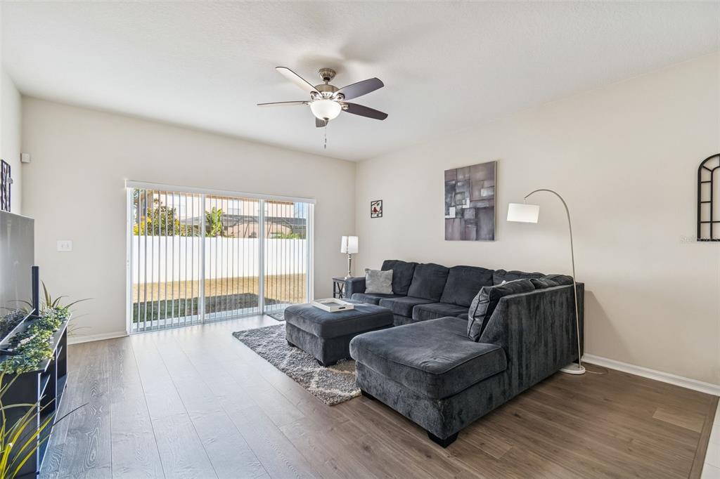 5956 Desert Peace Avenue Land O' Lakes, FL 34639 - Photo 27 of 79 a living room with furniture