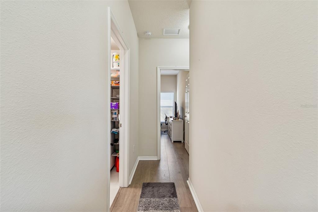 5956 Desert Peace Avenue Land O' Lakes, FL 34639 - Photo 40 of 79 a view of hallway with stairs and a bathroom