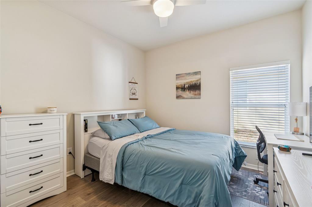 5956 Desert Peace Avenue Land O' Lakes, FL 34639 - Photo 41 of 79 a bedroom with a bed and a window