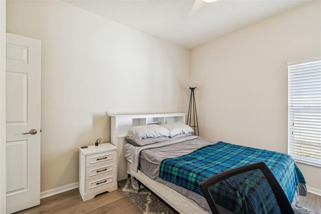 5956 Desert Peace Avenue Land O' Lakes, FL 34639 - Photo 46 of 79 a bedroom with a bed and with furniture