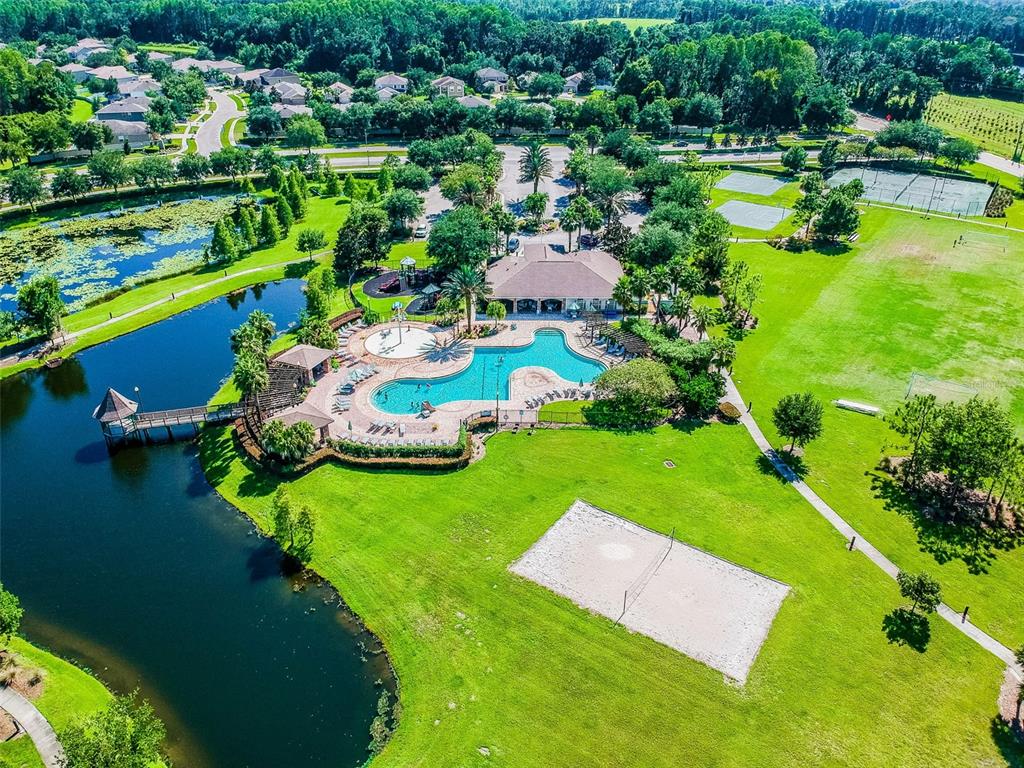 5956 Desert Peace Avenue Land O' Lakes, FL 34639 - Photo 66 of 79 an aerial view of a house with yard swimming pool and outdoor seating