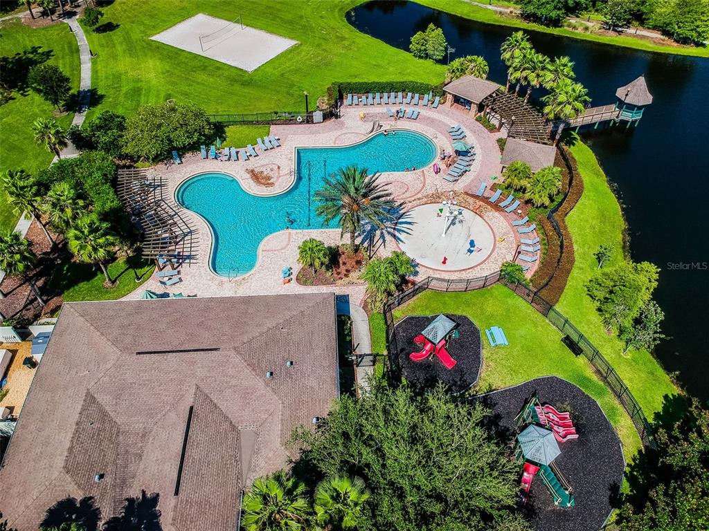 5956 Desert Peace Avenue Land O' Lakes, FL 34639 - Photo 70 of 79 an aerial view of residential house with outdoor space and pool