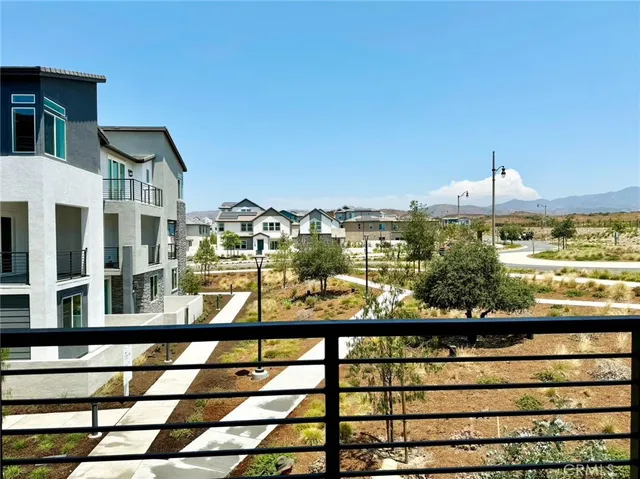 a view of a large building from a balcony