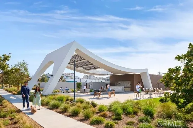a view of a living room kitchen and a large window