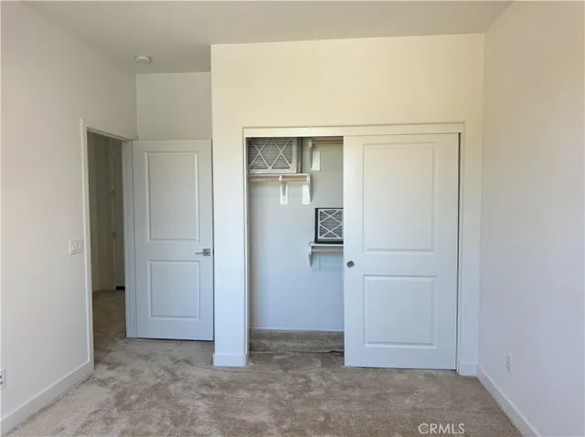 a bathroom with a shower sink vanity mirror and toilet