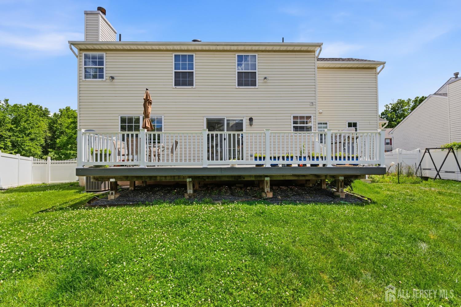 26 Alexis Lane Edison, NJ 08820 - Photo 34 of 39 a view of a house with porch and garden