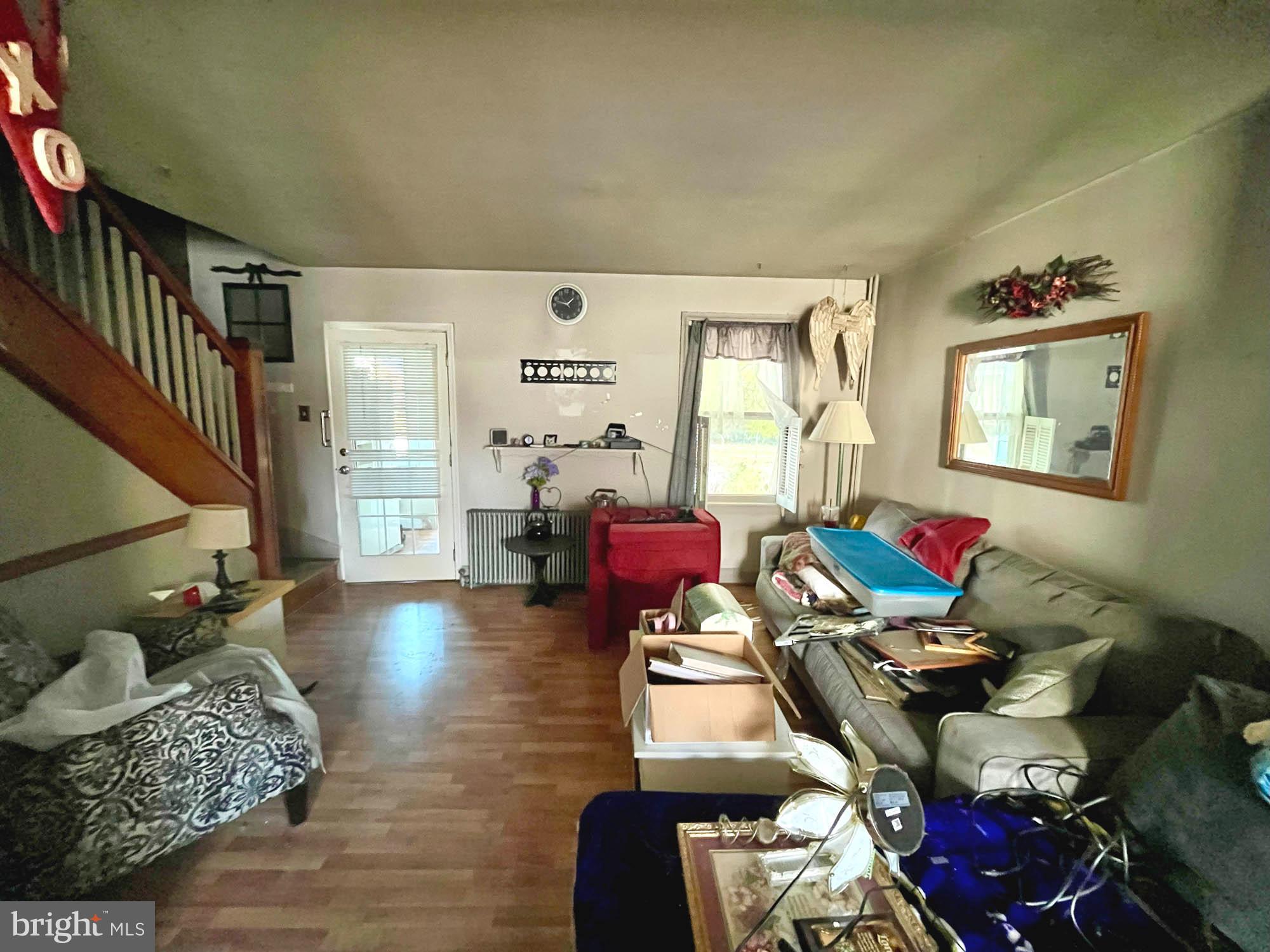 32 Township Road Baltimore, MD 21222 - Photo 4 of 16 a living room with furniture and wooden floor