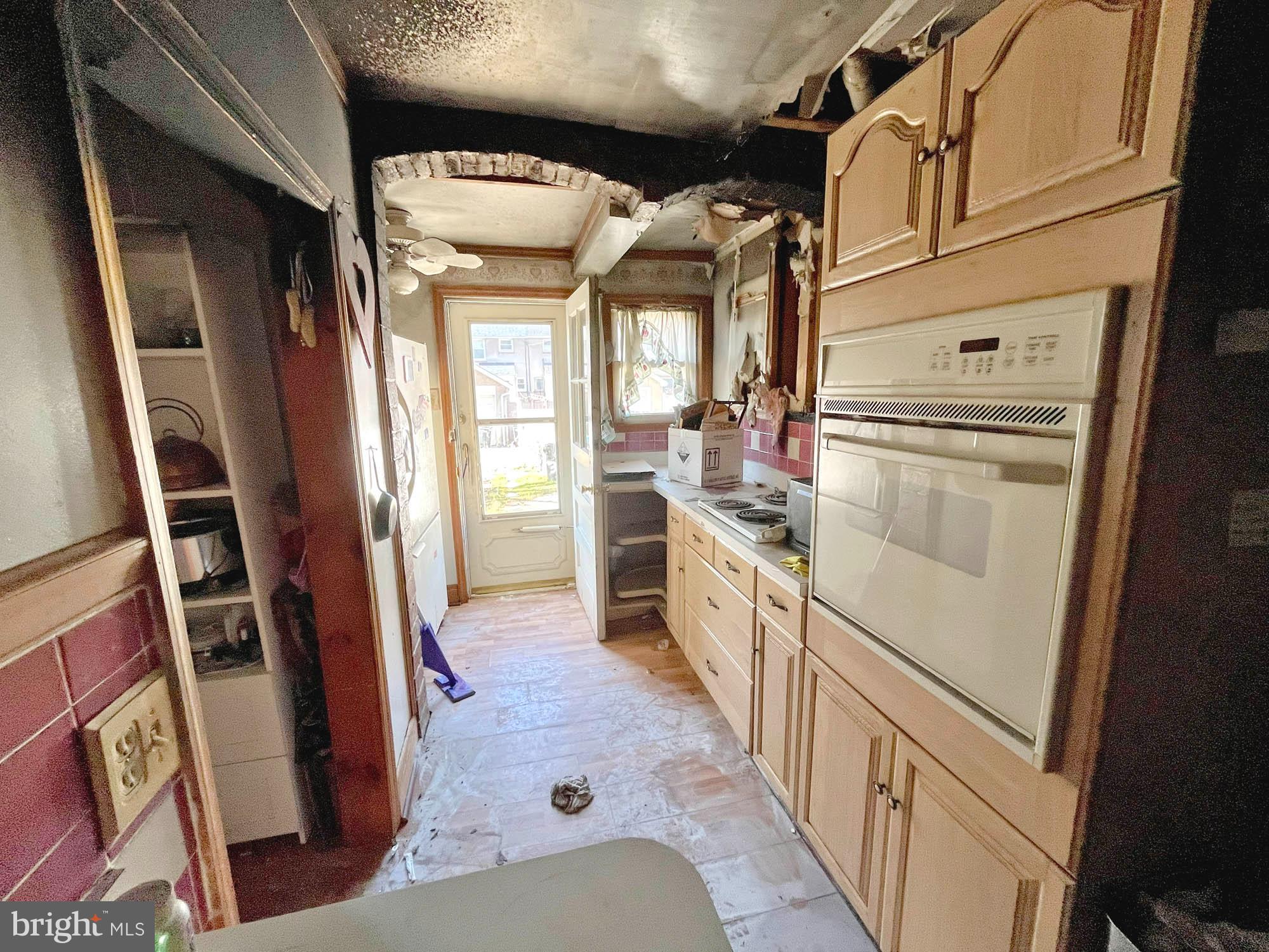 32 Township Road Baltimore, MD 21222 - Photo 6 of 16 a kitchen with window a sink and a refrigerator