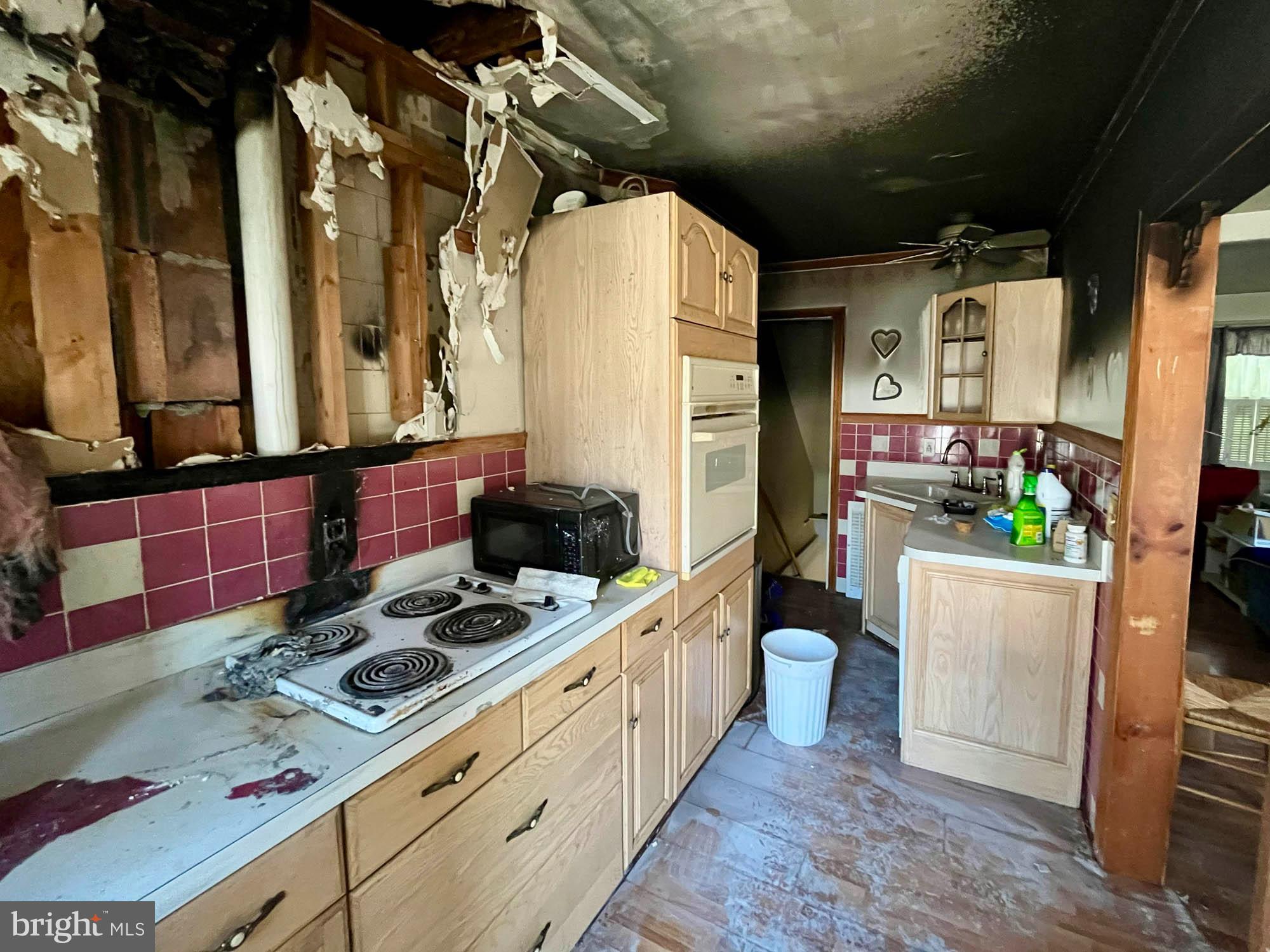 32 Township Road Baltimore, MD 21222 - Photo 7 of 16 a bathroom with a granite countertop sink and a mirror