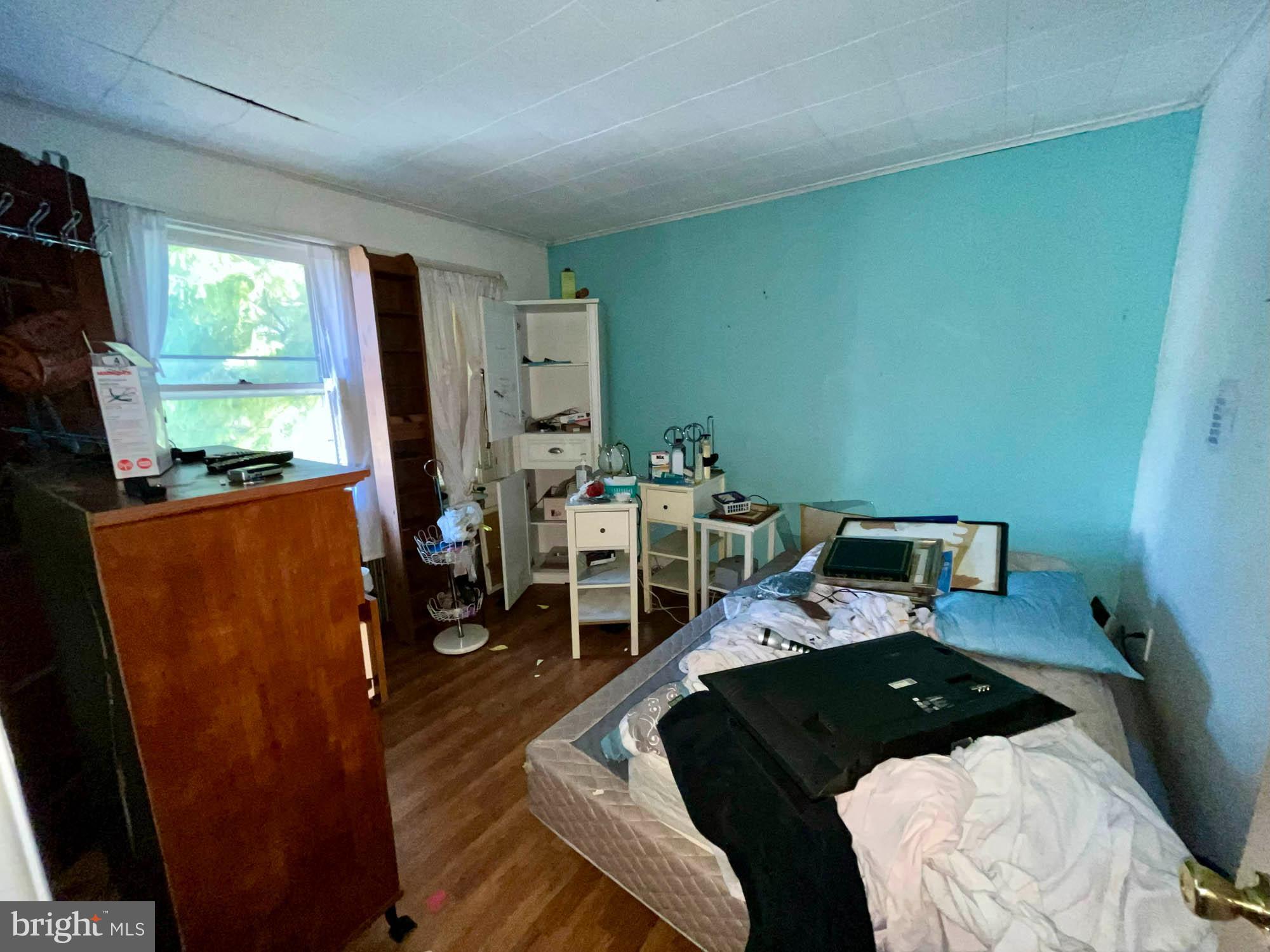 32 Township Road Baltimore, MD 21222 - Photo 9 of 16 a bedroom with furniture and a large window