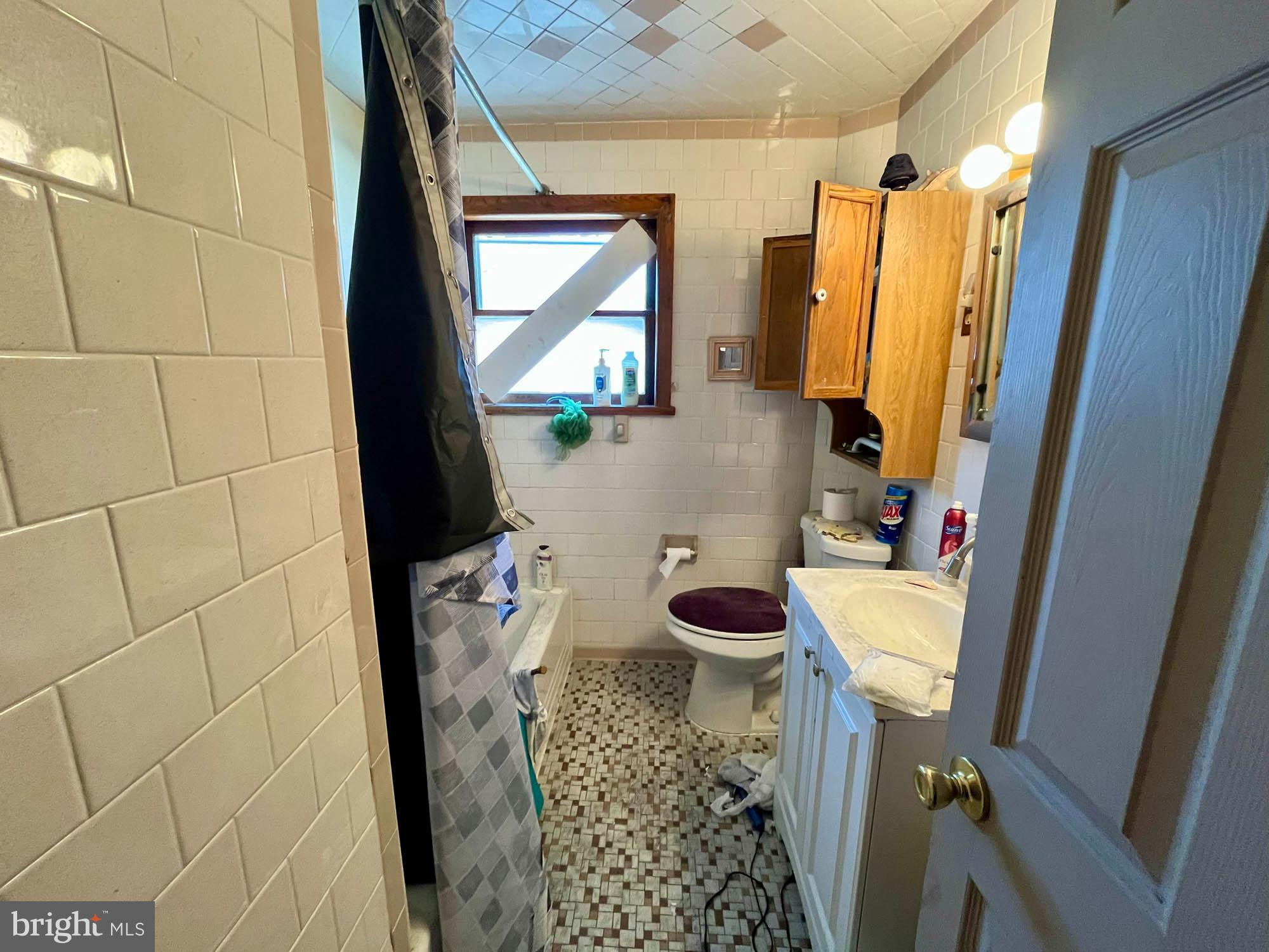 32 Township Road Baltimore, MD 21222 - Photo 10 of 16 a bathroom with a sink toilet and shower