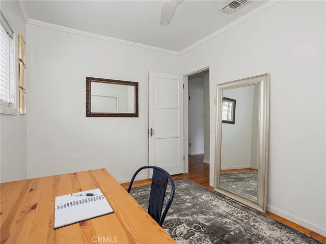 a view of a bedroom with bed and bathroom