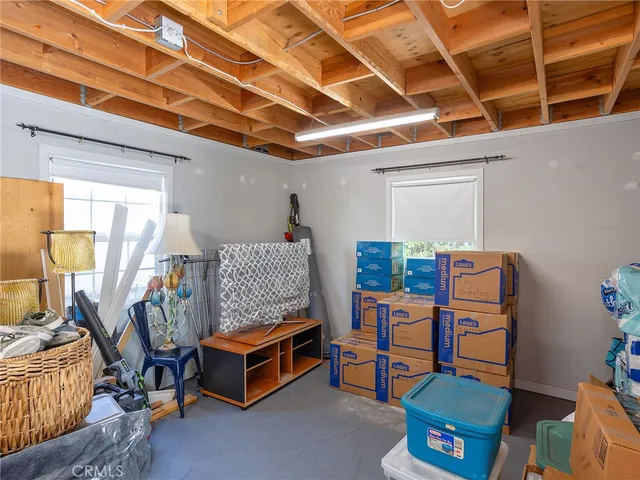 a living room with furniture and a garage