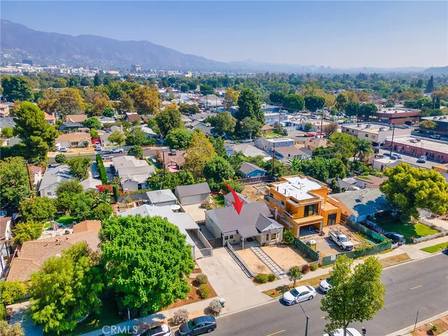 an aerial view of house with yard