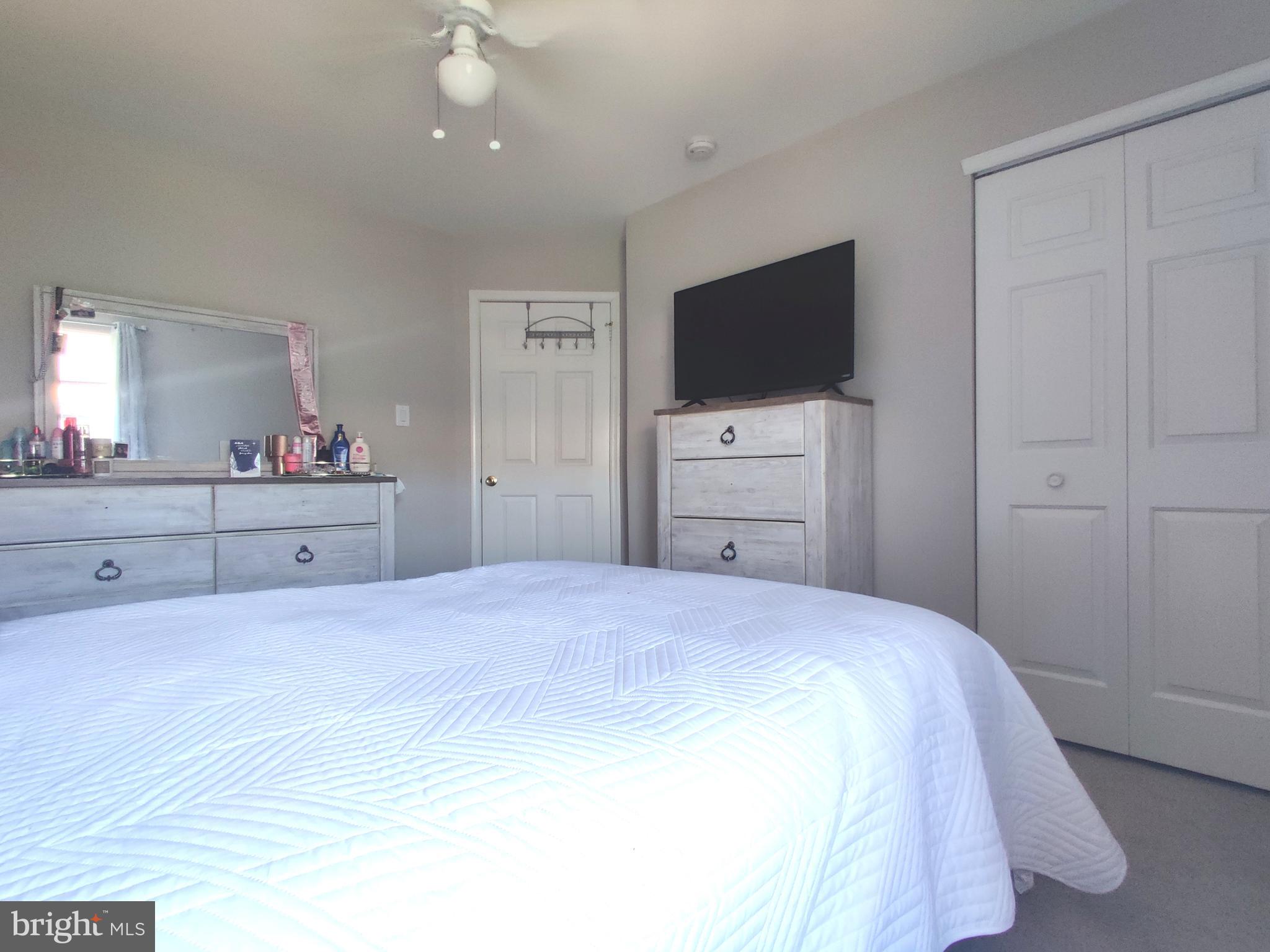 23 Stokes Road Mount Laurel, NJ 08054 - Photo 16 of 18 a bedroom with a bed and a flat screen tv