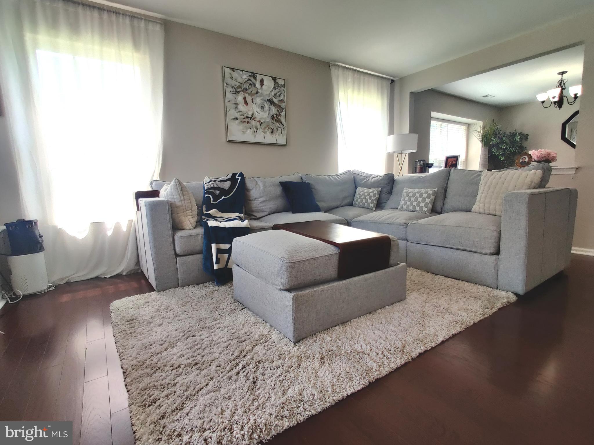 23 Stokes Road Mount Laurel, NJ 08054 - Photo 2 of 18 a living room with furniture and a large window