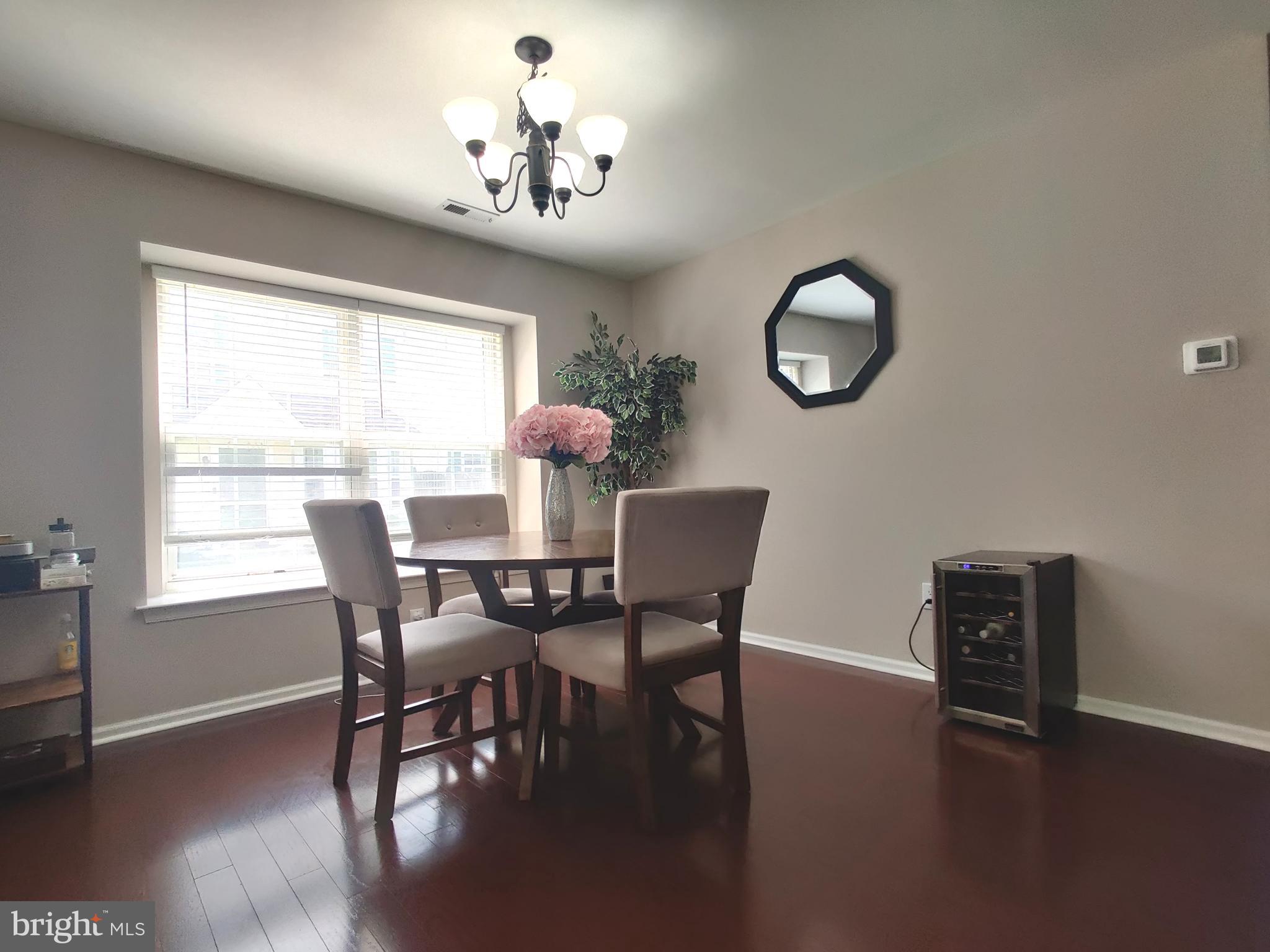 23 Stokes Road Mount Laurel, NJ 08054 - Photo 4 of 18 a view of a dining room with furniture window and wooden floor