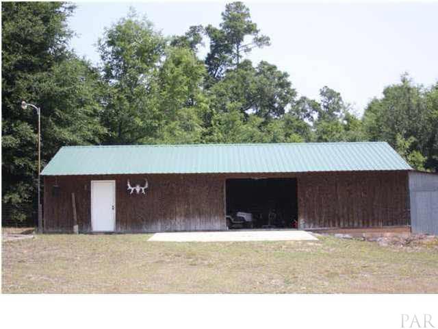8520 Beulah Road Pensacola, FL 32526 - Photo 14 of 14 This large shed/workshop has plenty of room to get the job done. This property is zoned for horses.