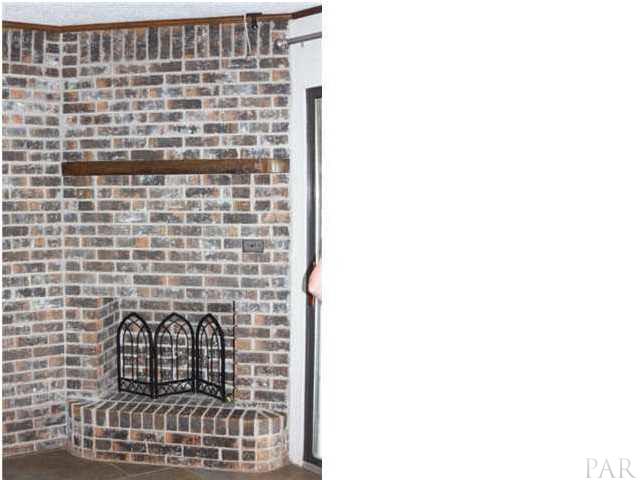 8520 Beulah Road Pensacola, FL 32526 - Photo 3 of 14 Fireplace in the family room which is open to the kitchen.